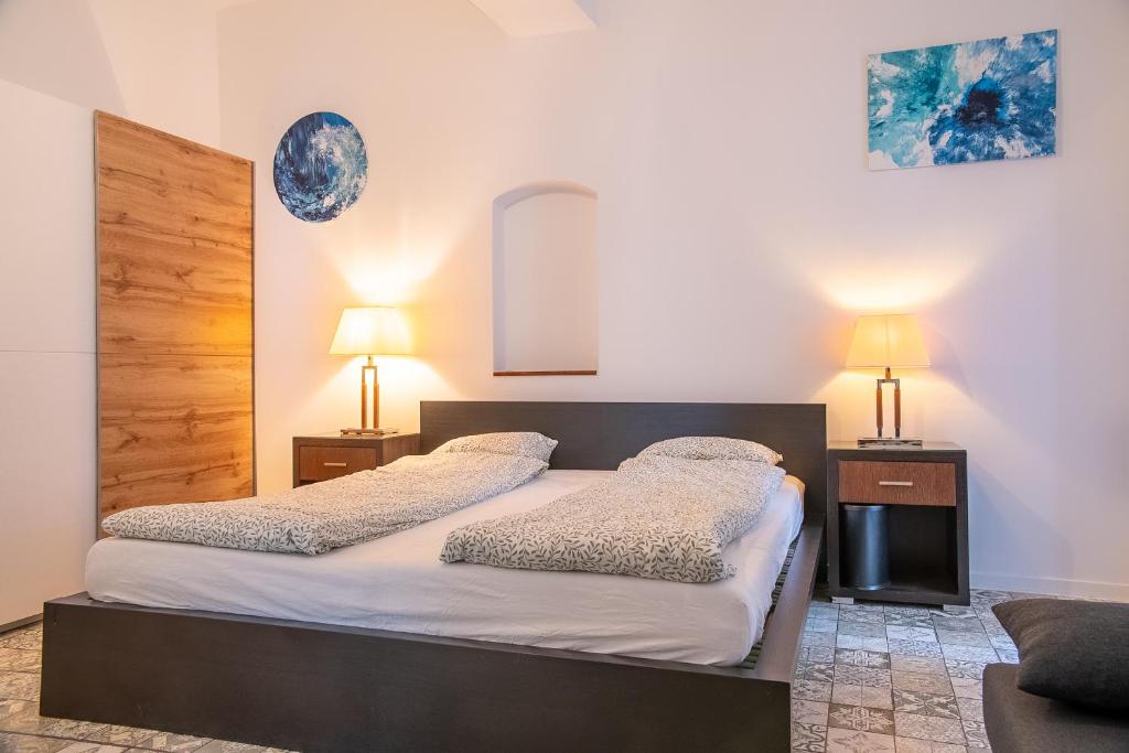 Кровать или кровати в номере Family&Friends Apartments Schönbrunn