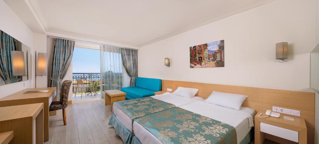 Postel nebo postele na pokoji v ubytování L'Oceanica Beach Resort