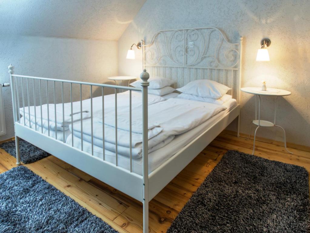 Postel nebo postele na pokoji v ubytování Guesthouse Stari Tišler