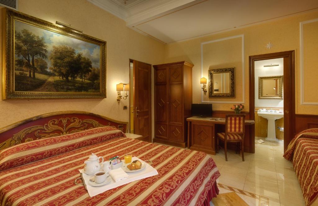 Postel nebo postele na pokoji v ubytování Hotel Bolivar