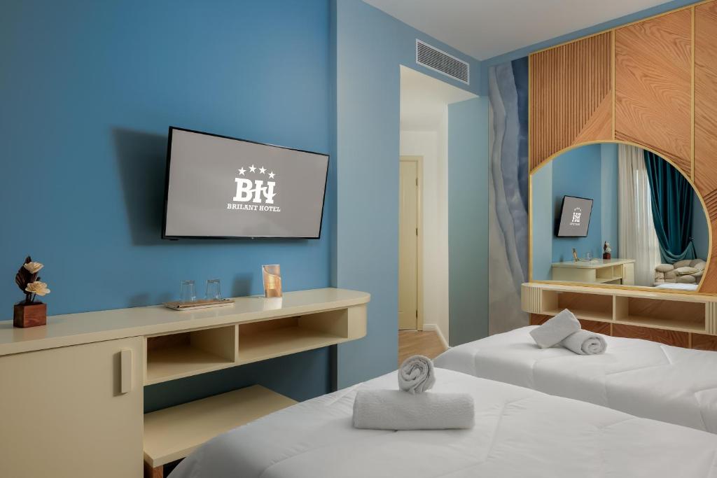 Postel nebo postele na pokoji v ubytování Hotel Brilant Saranda