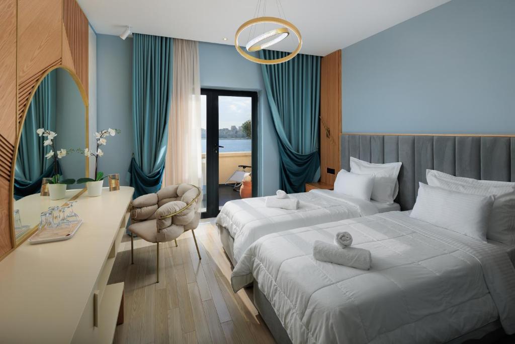 Postel nebo postele na pokoji v ubytování Hotel Brilant Saranda