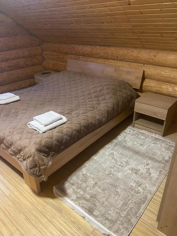 Postel nebo postele na pokoji v ubytování Smerekovyi Dvir