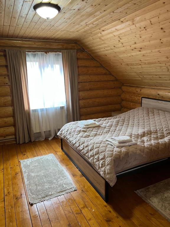 Postel nebo postele na pokoji v ubytování Smerekovyi Dvir