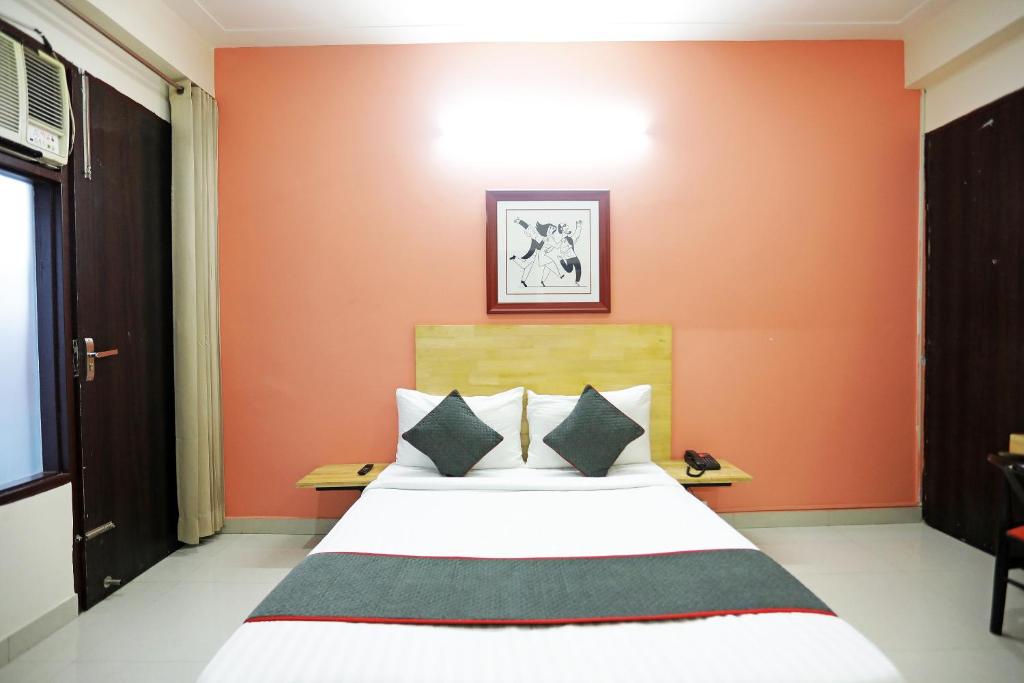 Postel nebo postele na pokoji v ubytování Super Townhouse Cloud Bay, Near Genpact, Sector-69, Gurgaon