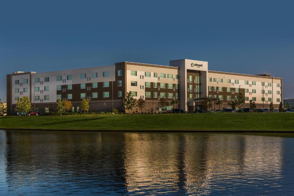 a large building next to a body of water at Element Houston Katy in Katy