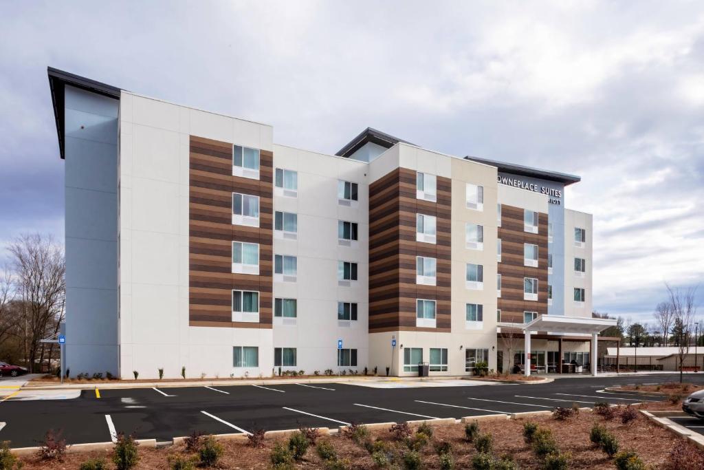 a rendering of a building with a parking lot at TownePlace Suites by Marriott Gainesville in Gainesville