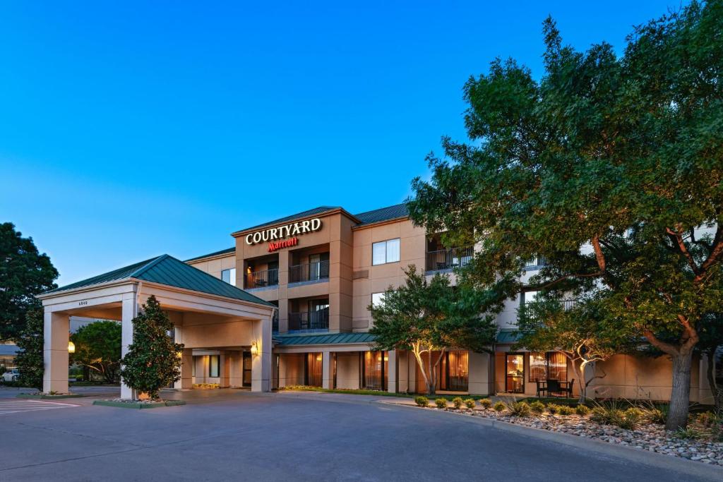 a rendering of the front of a hotel at Courtyard by Marriott Dallas Plano in Legacy Park in Plano
