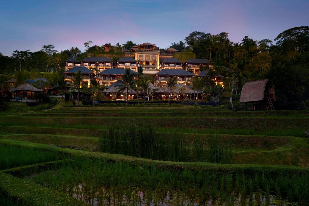 a resort in the middle of a rice field at Mandapa, a Ritz-Carlton Reserve in Ubud