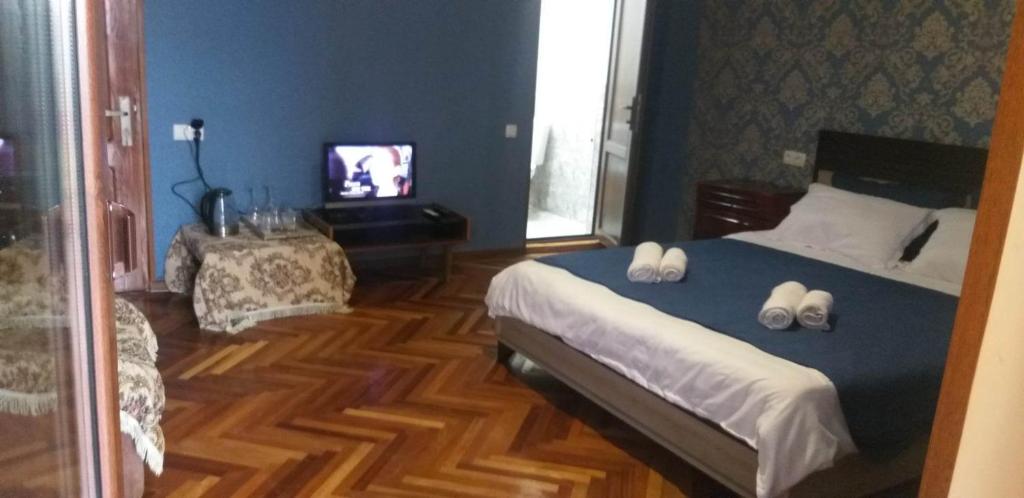 Postel nebo postele na pokoji v ubytování Guesthouse ''Door'' in Sighnaghi