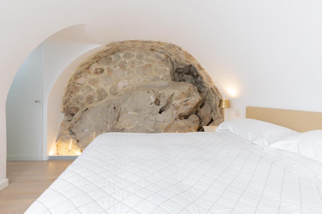 Postel nebo postele na pokoji v ubytování Casa Boutique by Capri 5 Senses