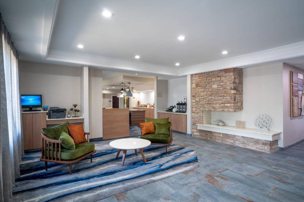 a living room with two chairs and a table at Fairfield Inn & Suites Memphis I-240 & Perkins in Memphis