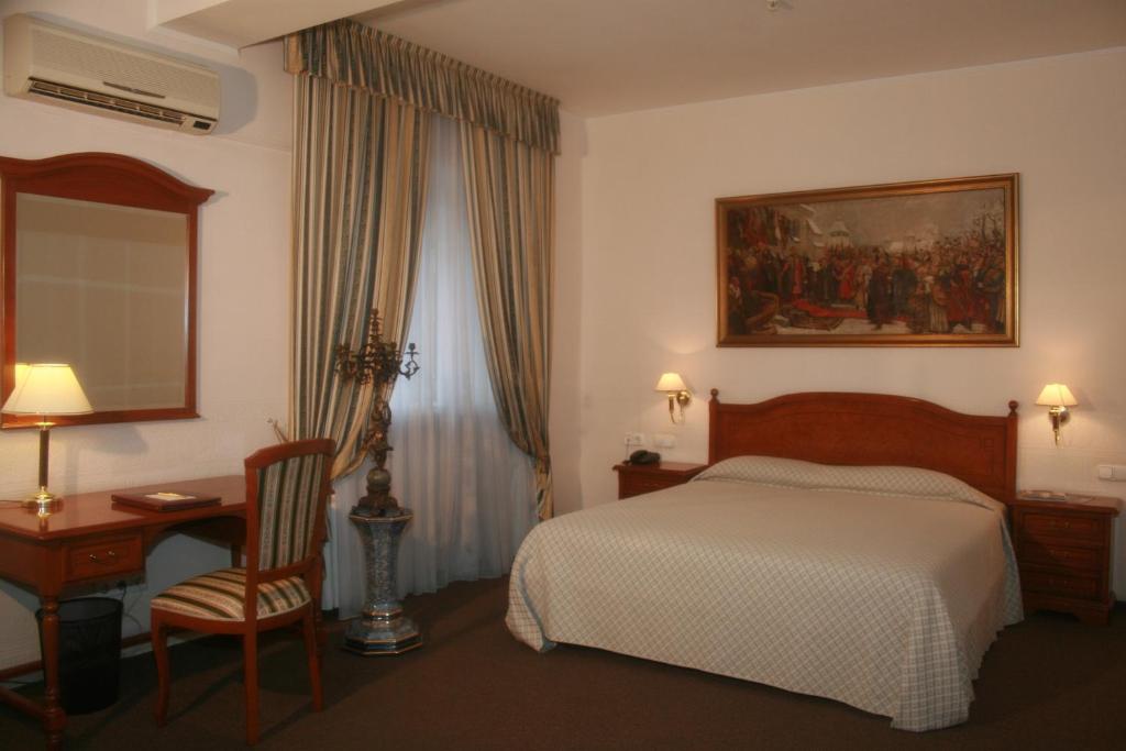 Postel nebo postele na pokoji v ubytování Art Hotel Academy
