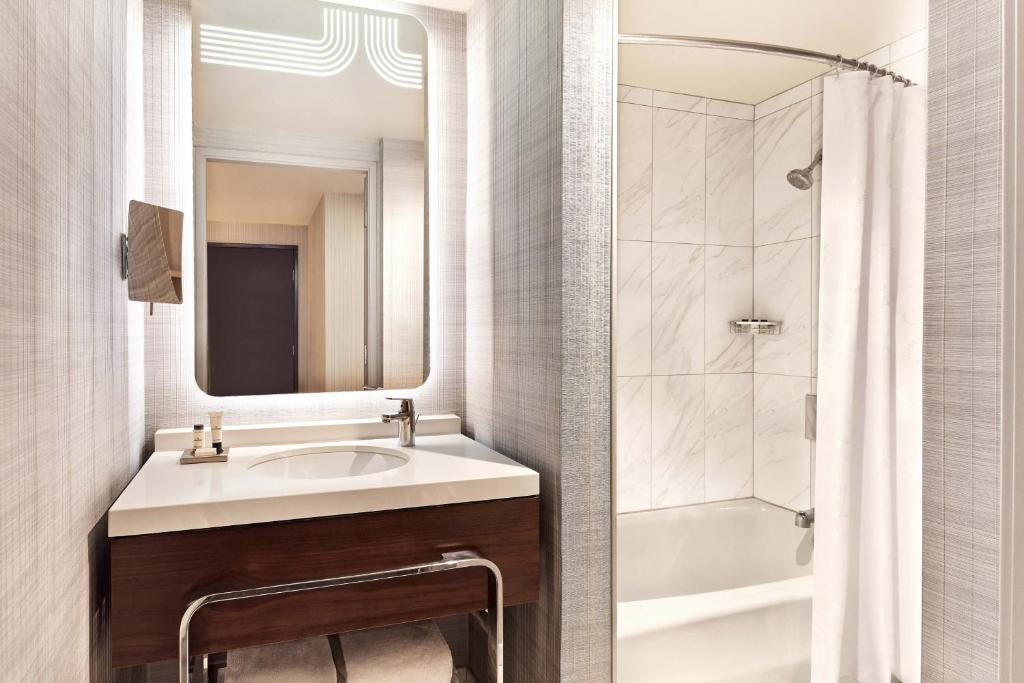 a bathroom with a sink and a shower at Sheraton Grand Los Angeles in Los Angeles
