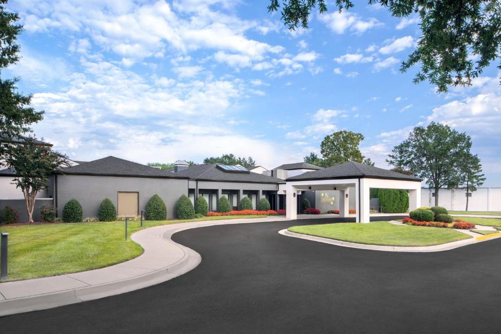 a rendering of a house with a driveway at Courtyard by Marriott Richmond West in Richmond
