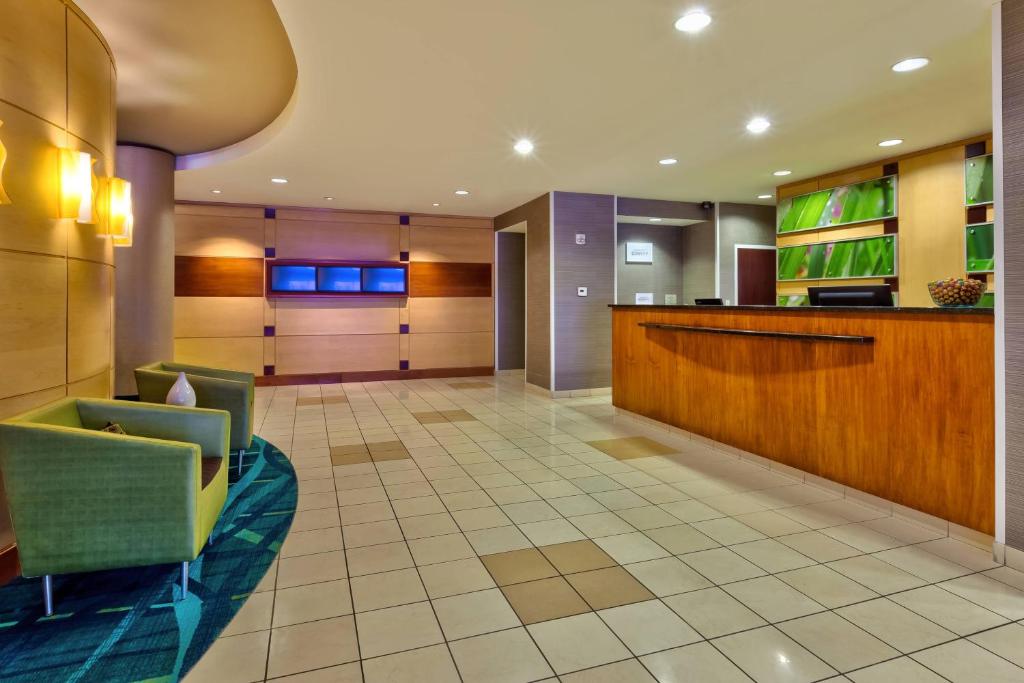 a lobby of a hotel with a waiting room at SpringHill Suites by Marriott Grand Rapids Airport Southeast in Cascade