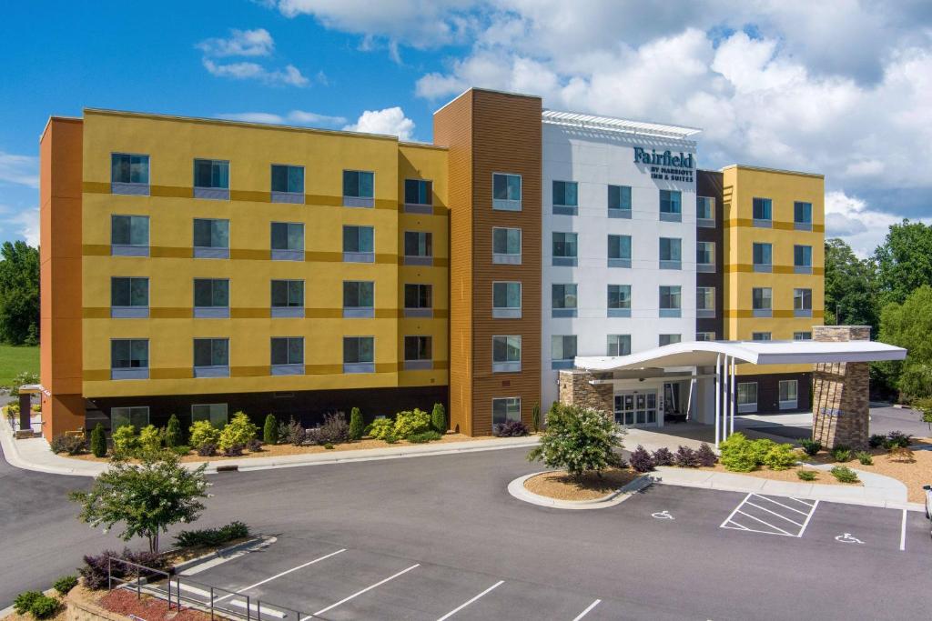 an image of a hotel with a parking lot at Fairfield Inn & Suites Rocky Mount in Rocky Mount