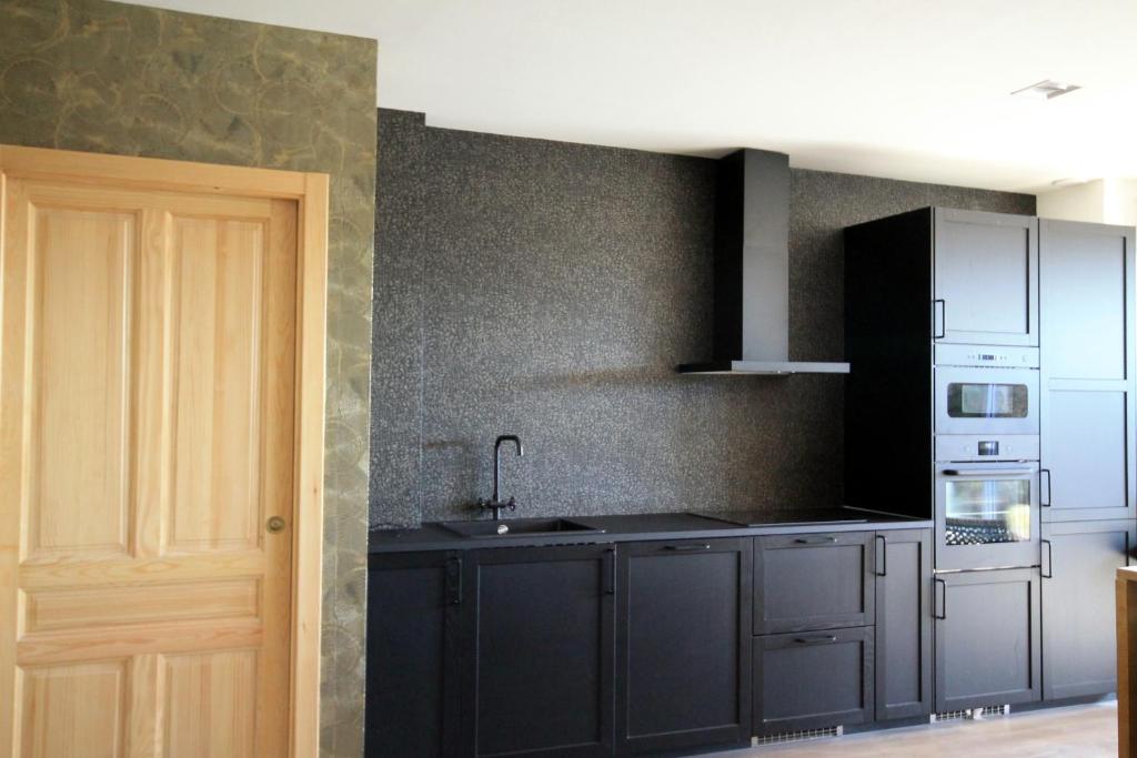 Kuchyňa alebo kuchynka v ubytovaní CASAS DA FORTALEZA Casa da Muralla