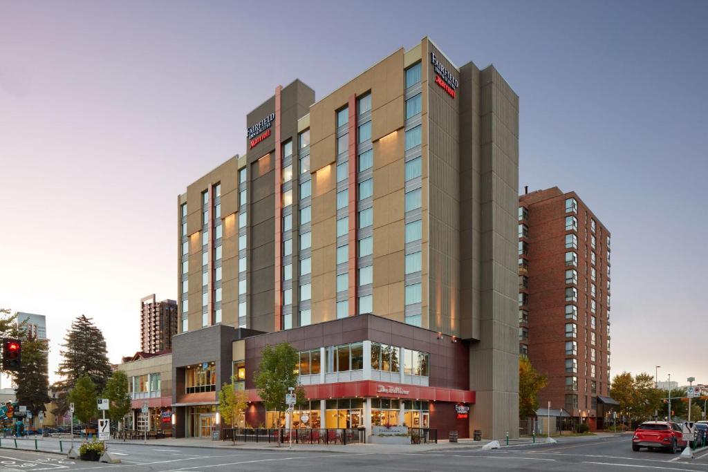 a large building in a city with a street at Fairfield Inn & Suites by Marriott Calgary Downtown in Calgary