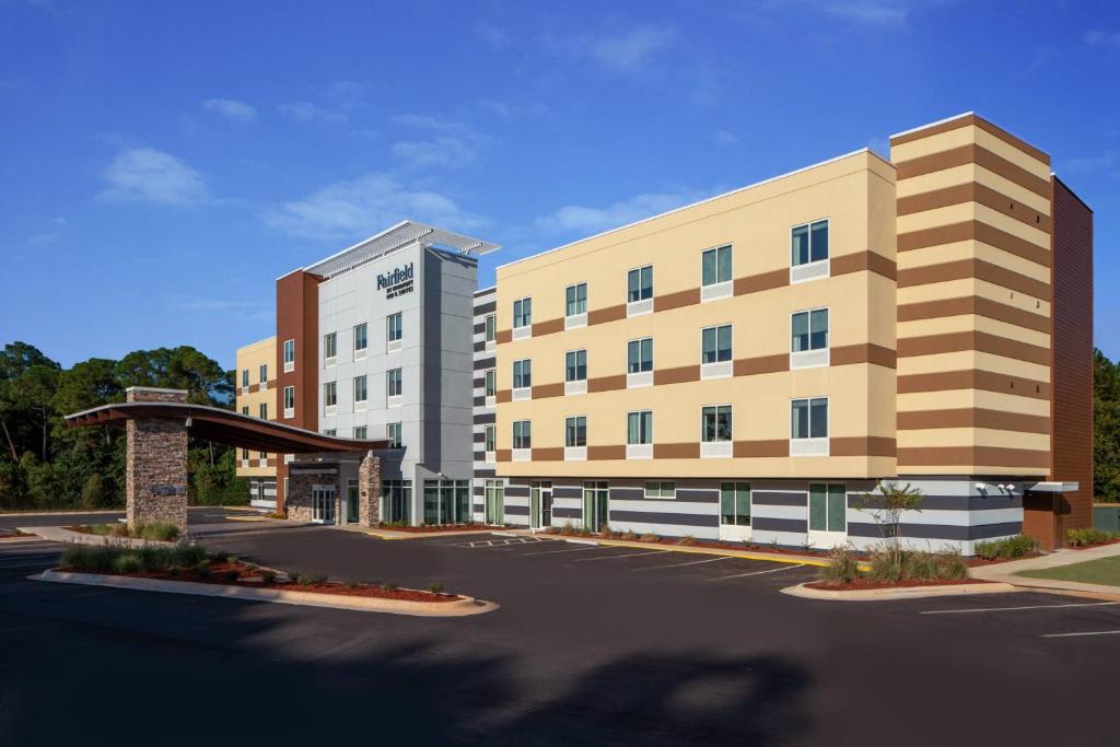 a rendering of a hotel building with a parking lot at Fairfield by Marriott Inn & Suites Pensacola Pine Forest in Pensacola