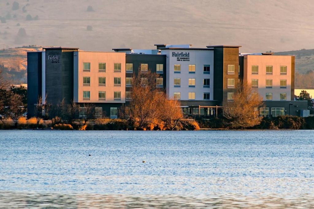 a large building next to a body of water at Fairfield Inn & Suites by Marriott Klamath Falls in Klamath Falls