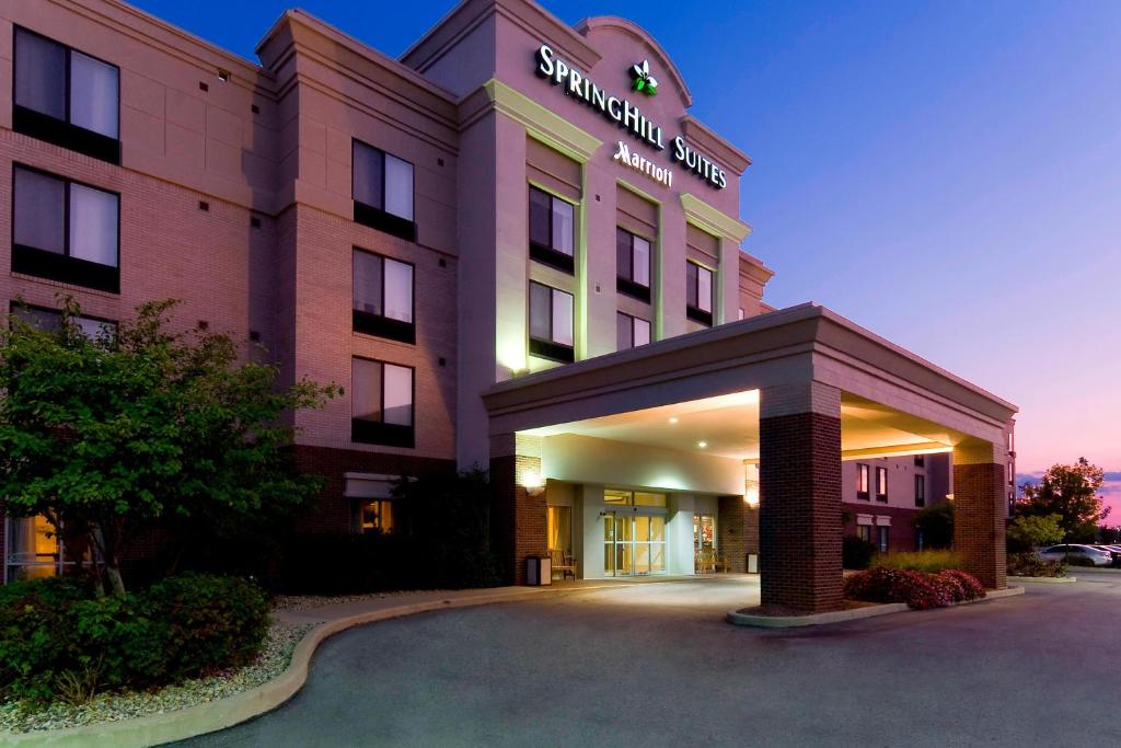 a hotel with a sign on the front of it at SpringHill Suites Indianapolis Carmel in Carmel