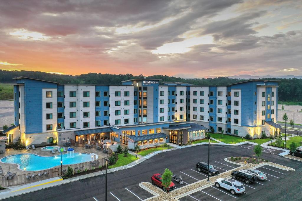 an aerial view of a hotel with a pool and parking lot at Residence Inn by Marriott Pigeon Forge in Pigeon Forge