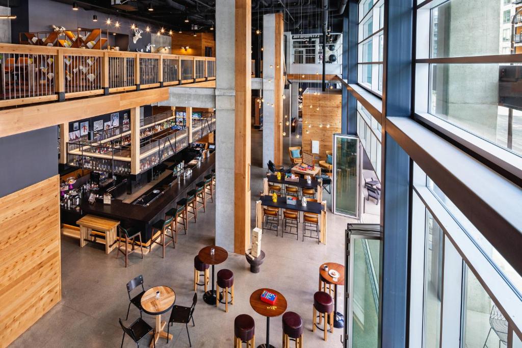 an overhead view of a restaurant with tables and chairs at Moxy Minneapolis Downtown in Minneapolis