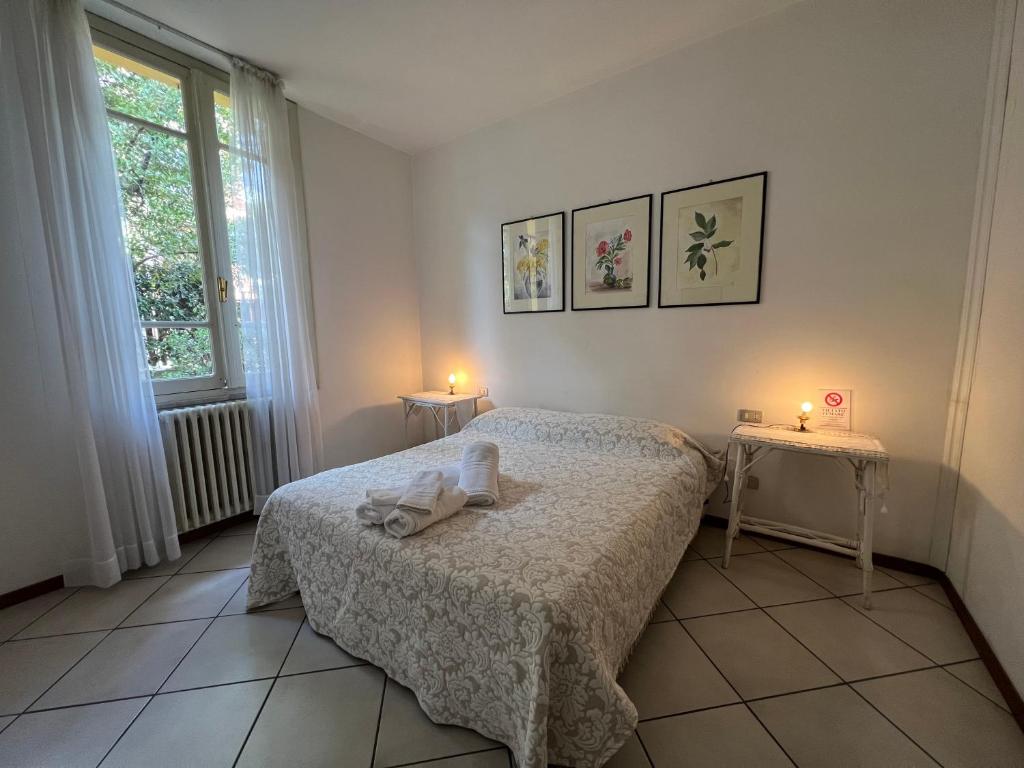A bed or beds in a room at Casa Viale Amico - Giardino Privato
