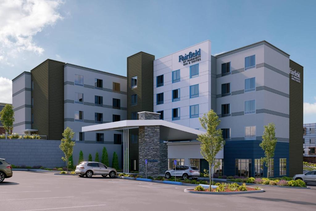 an architectural rendering of a hotel with a parking lot at Fairfield by Marriott Inn & Suites Kansas City North, Gladstone in Kansas City