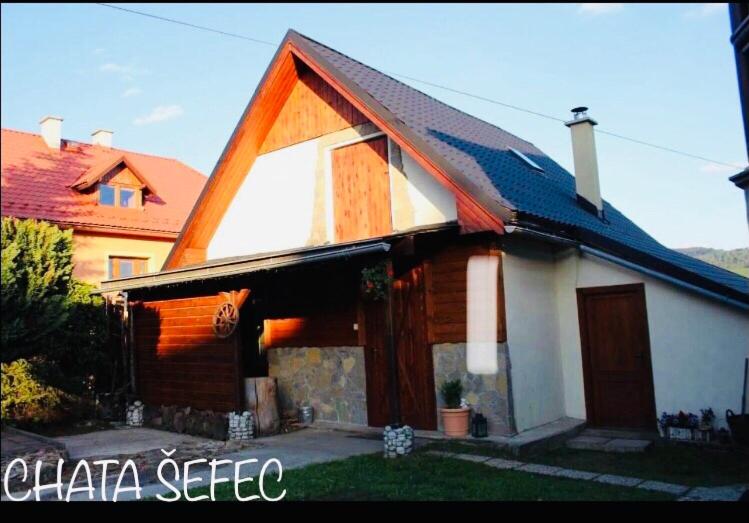 a house with a gambrel roof at CHATA ŠEFEC holiday resort Východná in Východná