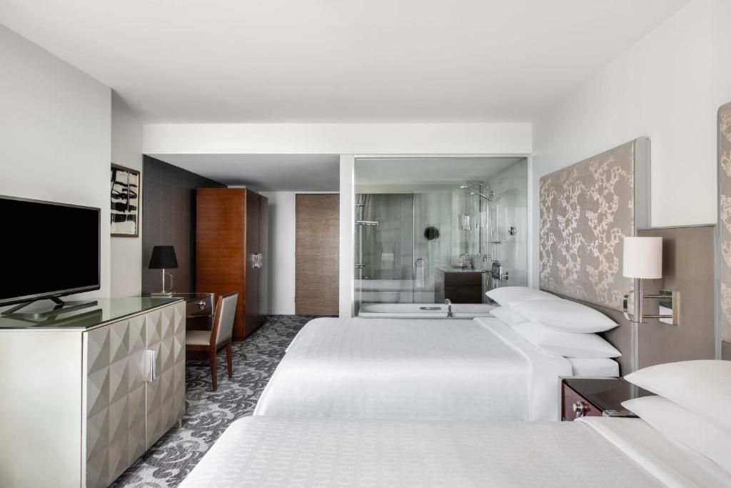 Postel nebo postele na pokoji v ubytování Sheraton Melbourne Hotel