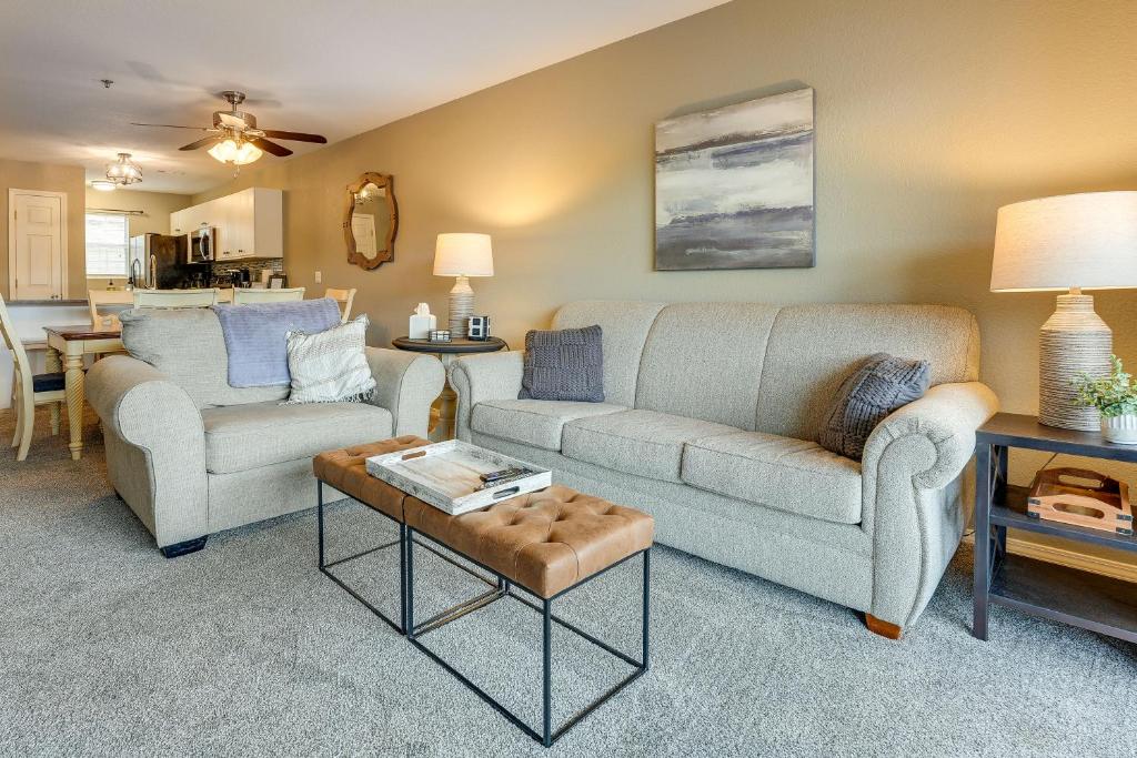 a living room with two couches and a table at Branson Condo - 3 Mi to Table Rock State Park! in Branson