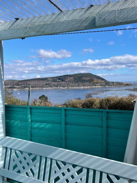 a view of the water from the balcony of a house at No.9 in Inverness