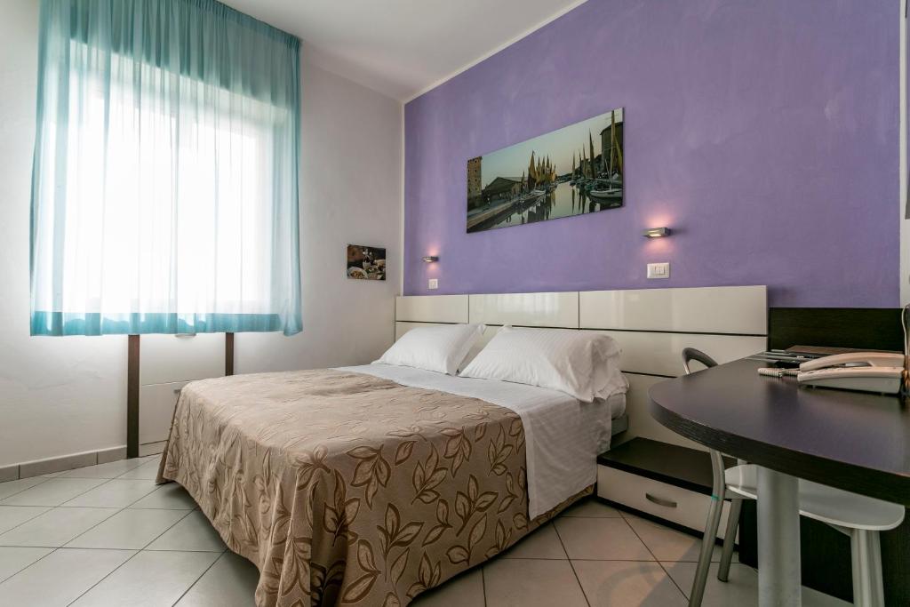 Postel nebo postele na pokoji v ubytování Hotel Baya - in centro, sul mare