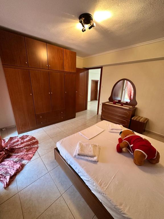 A bed or beds in a room at Archontia Apartment