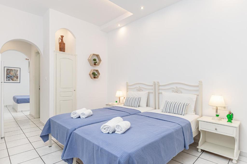 Postel nebo postele na pokoji v ubytování Zanneta Apartments & Suites