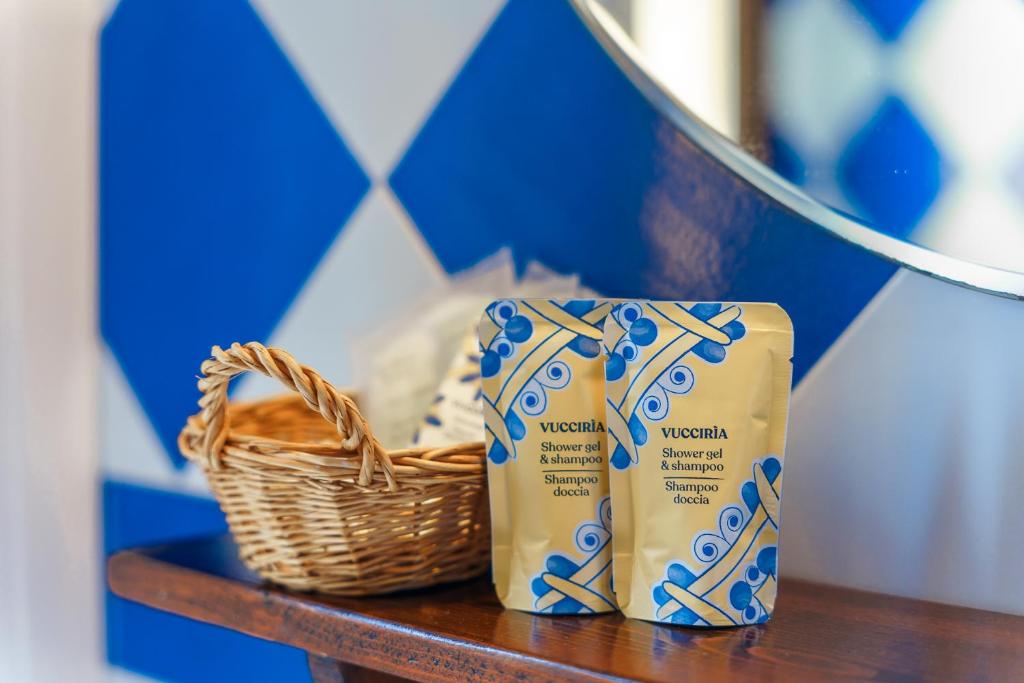 a basket and a bag of milk on a table at Casale Ginisara in Castellammare del Golfo