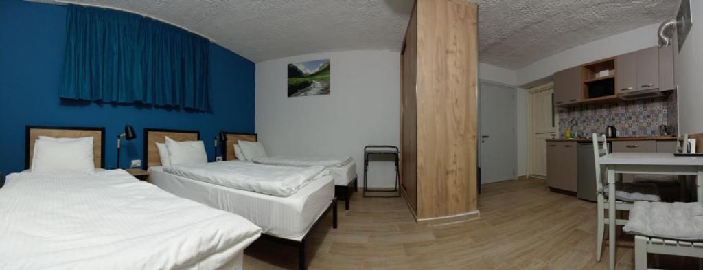 Postel nebo postele na pokoji v ubytování Apart-hotel TARHUN