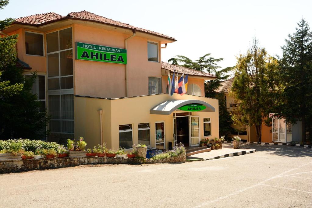 a hotel with a sign that reads antilla at Ahilea Hotel - Free Pool Access in Balchik