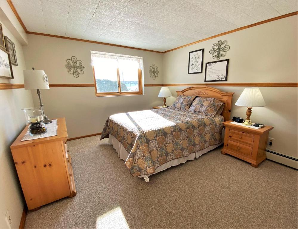 A bed or beds in a room at Hazel House