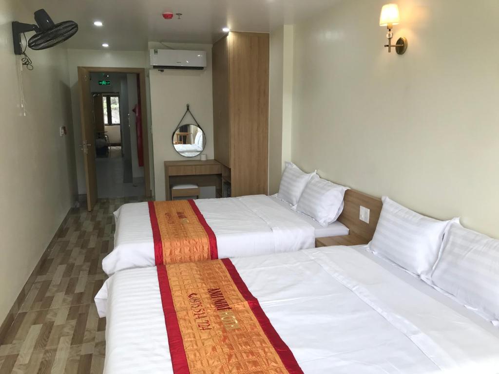 Postel nebo postele na pokoji v ubytování Anh Nhu Hotel
