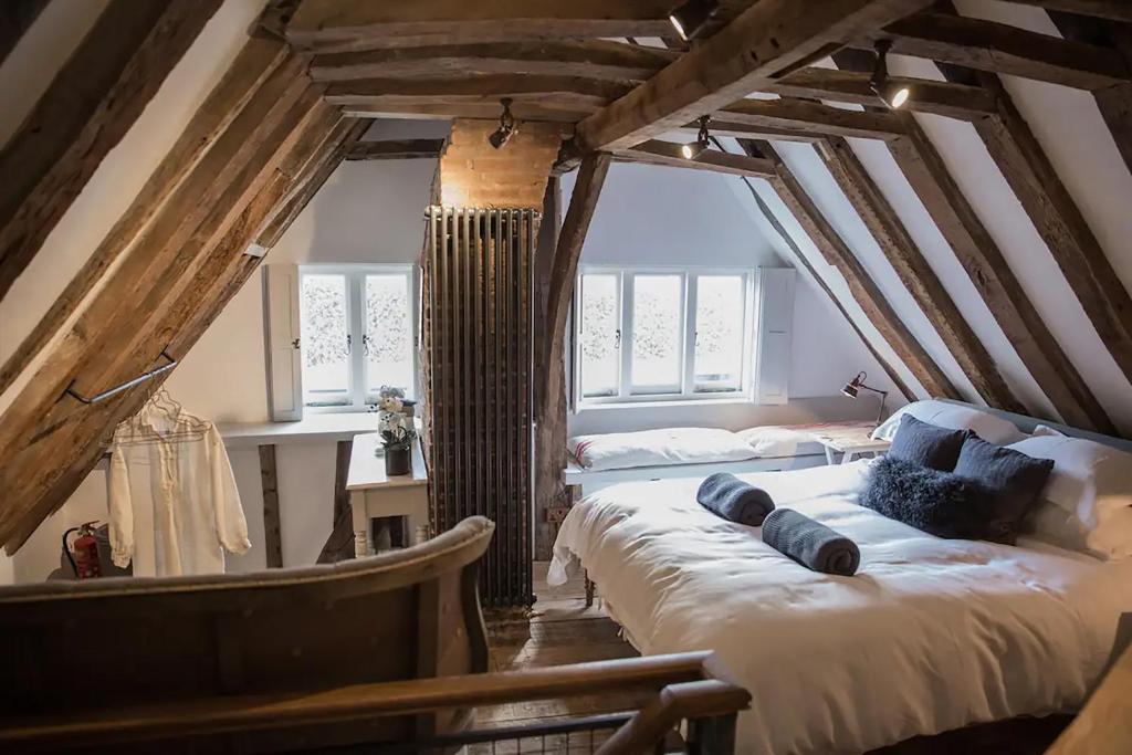 a bedroom with two beds in an attic at West Street Loft in Midhurst