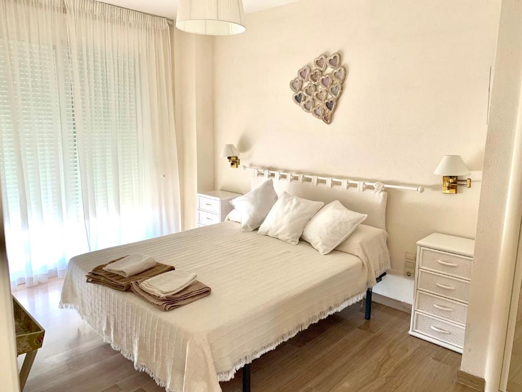 Posteľ alebo postele v izbe v ubytovaní Apartamento con vistas al mar