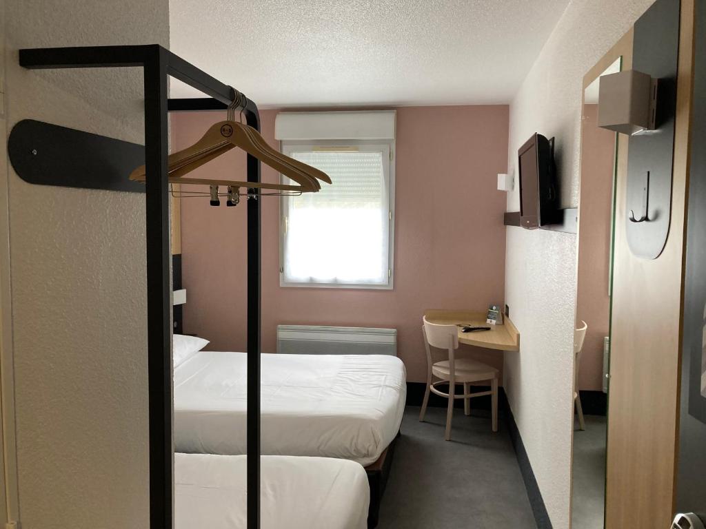 Postel nebo postele na pokoji v ubytování B&B HOTEL Le Tréport Friville