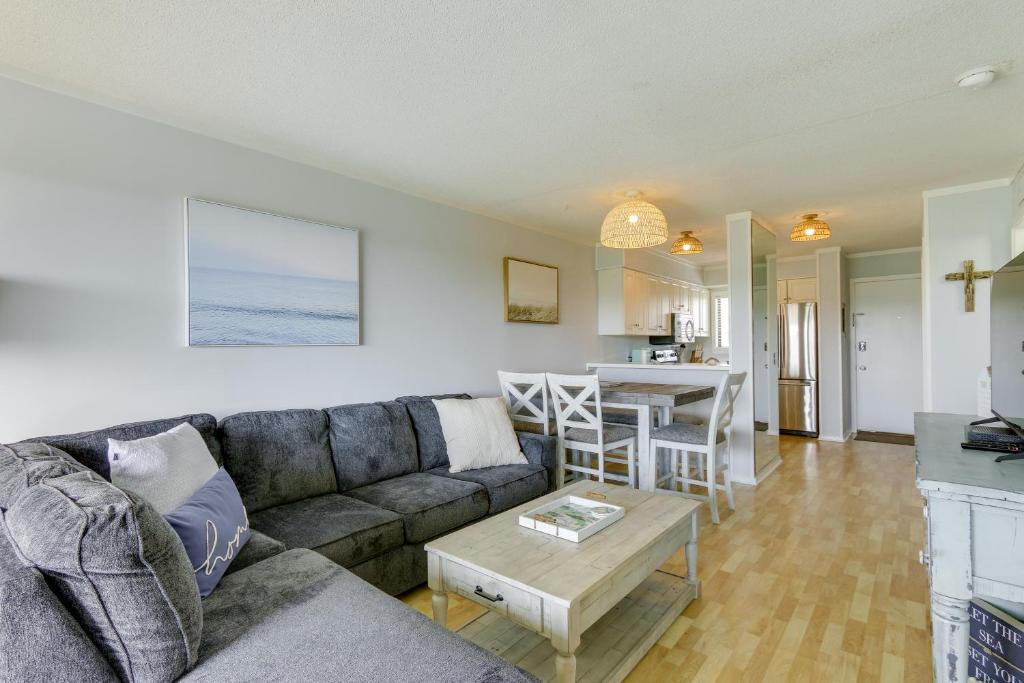 a living room with a couch and a table at Walk to Beach Hilton Head Condo with Golf Views in Hilton Head Island