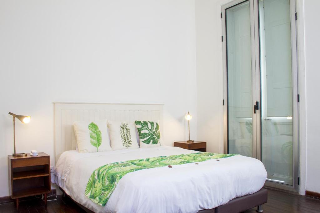 Postel nebo postele na pokoji v ubytování Hotel Casa de la Vega