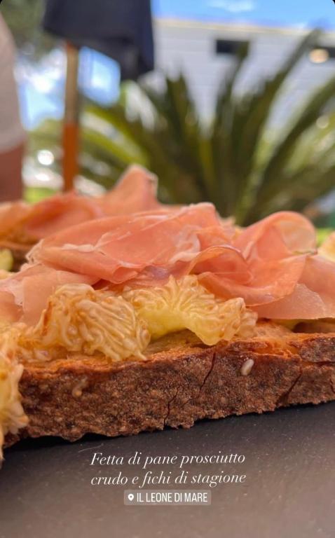 a close up of a sandwich with meat on it at Il Leone Di Mare in Procida