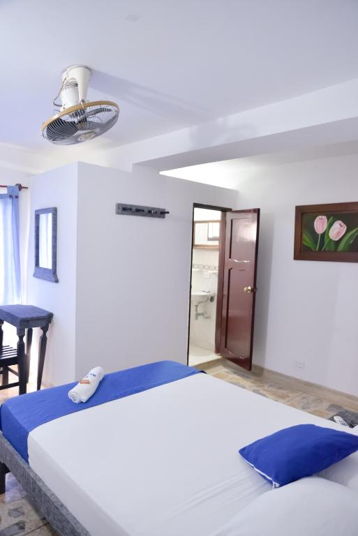 Postel nebo postele na pokoji v ubytování Hotel Acapulco Caucasia