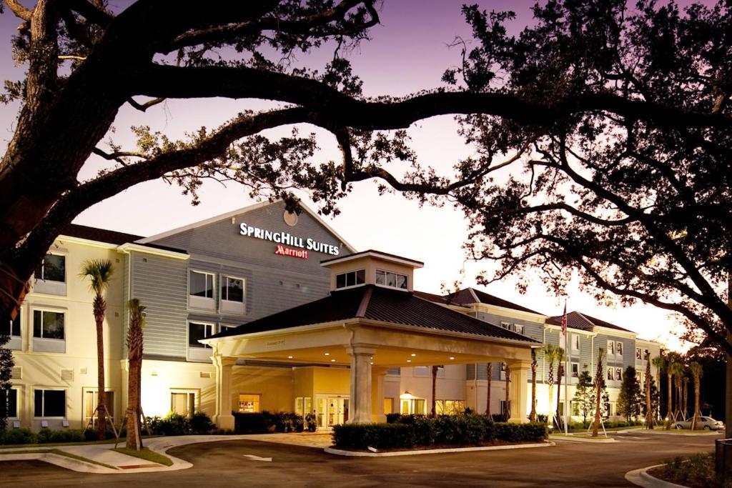 a hotel building with a sign on the front of it at SpringHill Suites Vero Beach in Vero Beach